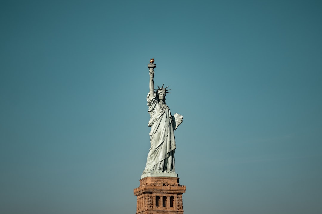 A family visiting U.S. landmarks like the Statue of Liberty - b2 visa lawyer
