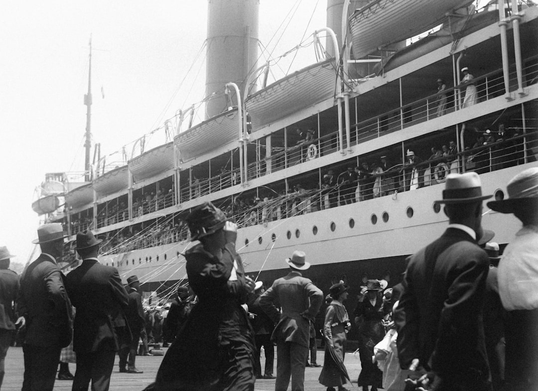 Historical image of immigrants arriving at Ellis Island - US immigration law Historical image of immigrants arriving at Ellis Island - US immigration law